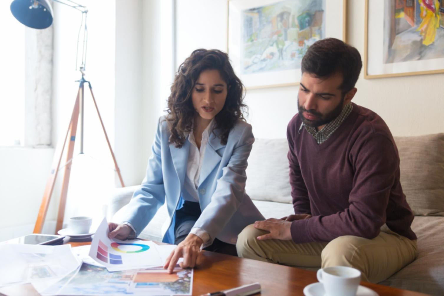 Person reviewing financial statements in comfortable home setting